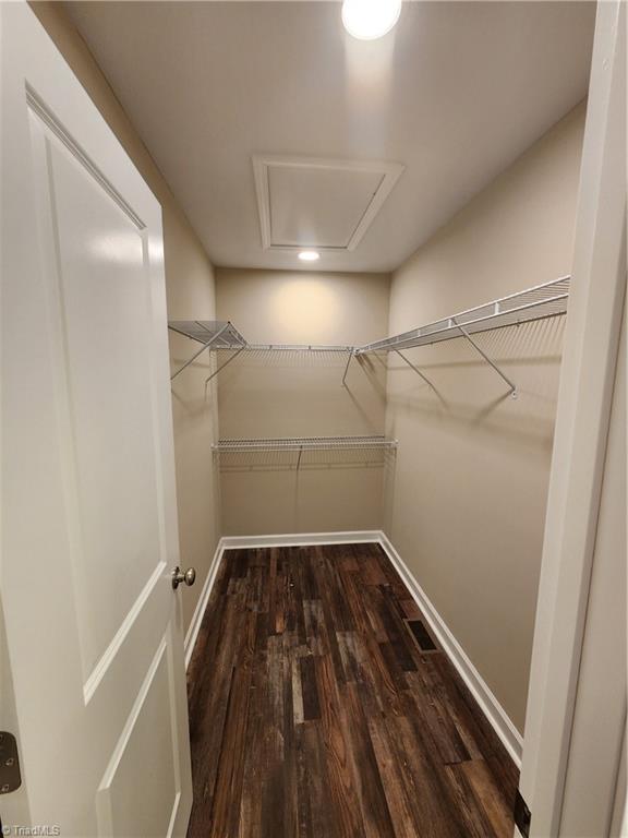 402 High Point St, Randleman, NC 27317 - spacious closet featuring dark wood finished floors