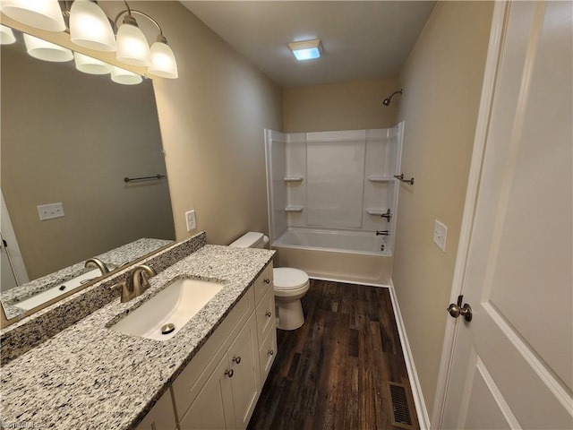 402 High Point St, Randleman, NC 27317 - bathroom with wood finished floors, vanity, toilet, shower / bath combination, and baseboards