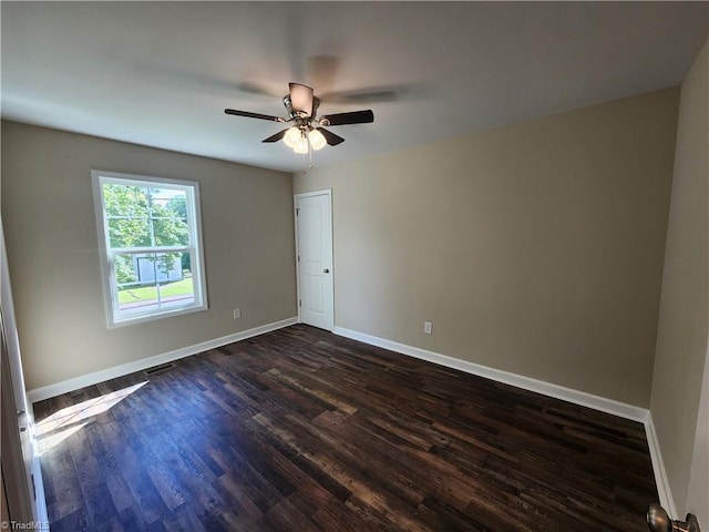 402 High Point St, Randleman, NC 27317 - unfurnished room featuring dark wood finished floors, baseboards, and a ceiling fan