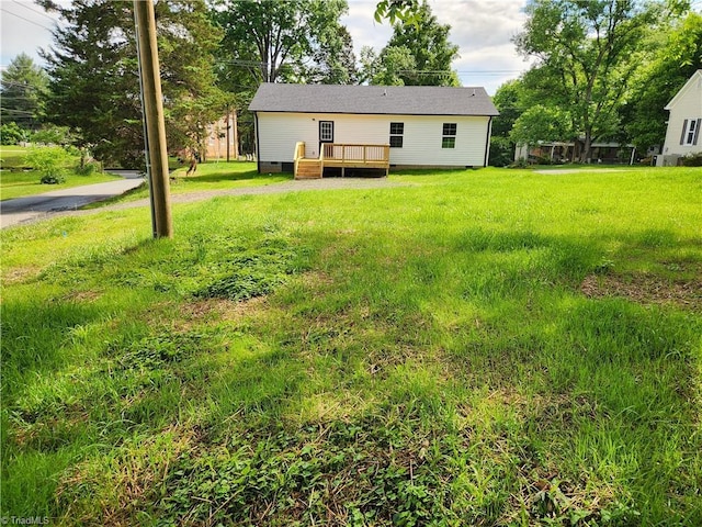 402 High Point St, Randleman, NC 27317 - view of grassy yard featuring a deck