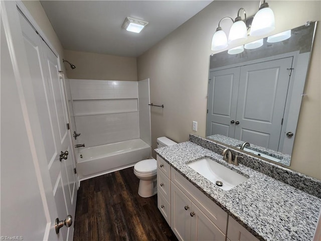 402 High Point St, Randleman, NC 27317 - bathroom featuring wood finished floors, toilet, vanity, and washtub / shower combination