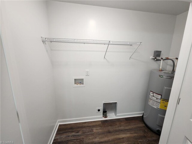 402 High Point St, Randleman, NC 27317 - laundry room with water heater, dark wood-style floors, hookup for an electric dryer, washer hookup, and baseboards