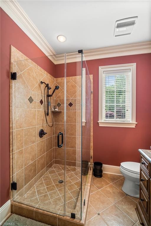 bathroom with toilet, vanity, ornamental molding, walk in shower, and tile flooring