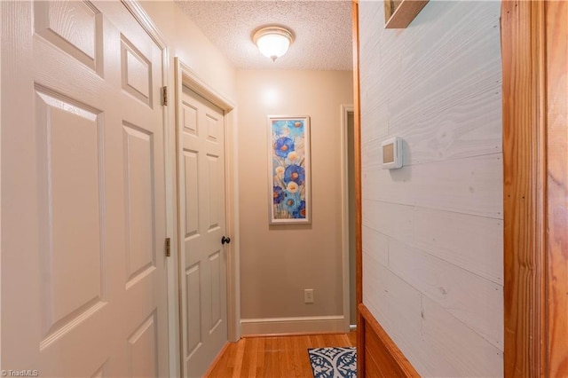 1160 Flinty Knoll Rd, Pinnacle, NC 27043 - hall with light wood-style floors, baseboards, and a textured ceiling
