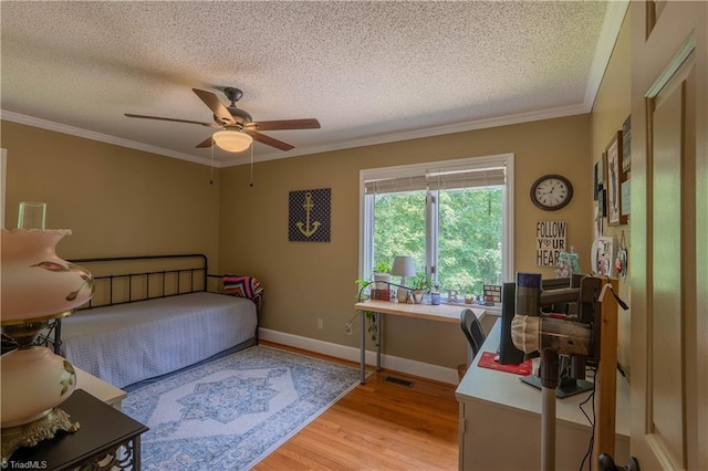 1160 Flinty Knoll Rd, Pinnacle, NC 27043 - bedroom with a textured ceiling, light wood finished floors, ornamental molding, baseboards, and ceiling fan