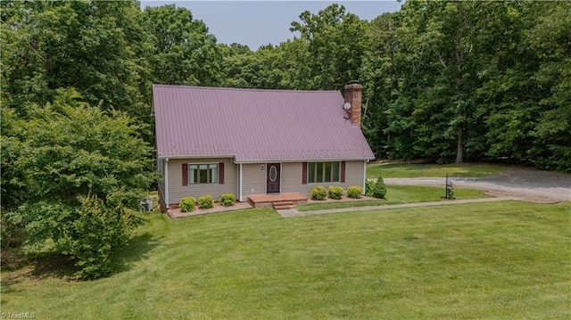 1160 Flinty Knoll Rd, Pinnacle, NC 27043 - view of front of home featuring a chimney, a front lawn, metal roof, and a view of trees