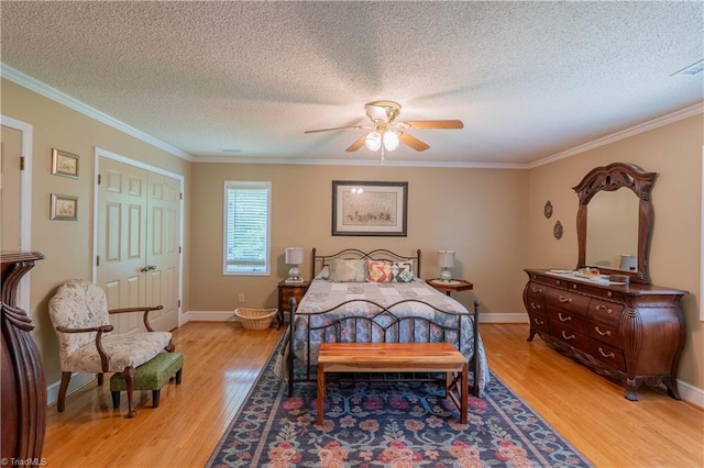 1160 Flinty Knoll Rd, Pinnacle, NC 27043 - bedroom featuring light wood-style floors, crown molding, a textured ceiling, ceiling fan, and baseboards
