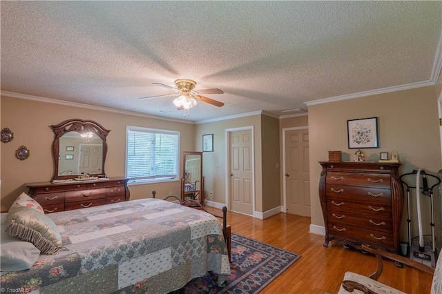 1160 Flinty Knoll Rd, Pinnacle, NC 27043 - bedroom with light wood-type flooring, a textured ceiling, crown molding, ceiling fan, and baseboards
