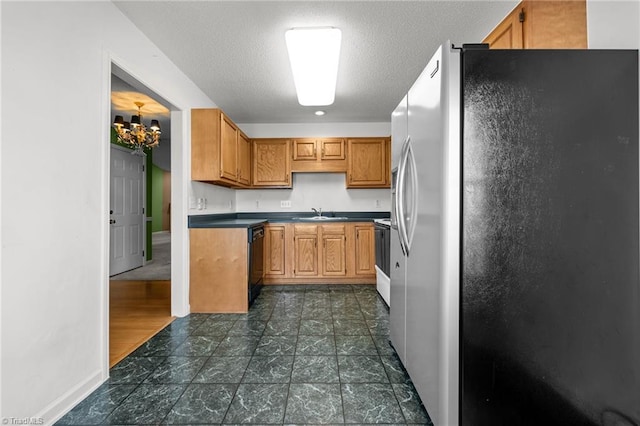 3027 Maple Ave Unit M2, Burlington, NC 27215 - kitchen featuring stainless steel refrigerator with ice dispenser, a chandelier, black dishwasher, electric stove, and baseboards