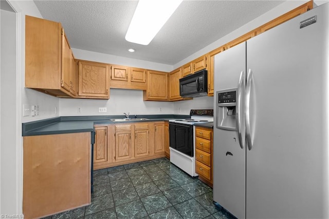 3027 Maple Ave Unit M2, Burlington, NC 27215 - kitchen featuring stainless steel fridge, black microwave, electric range oven, dark countertops, and a textured ceiling