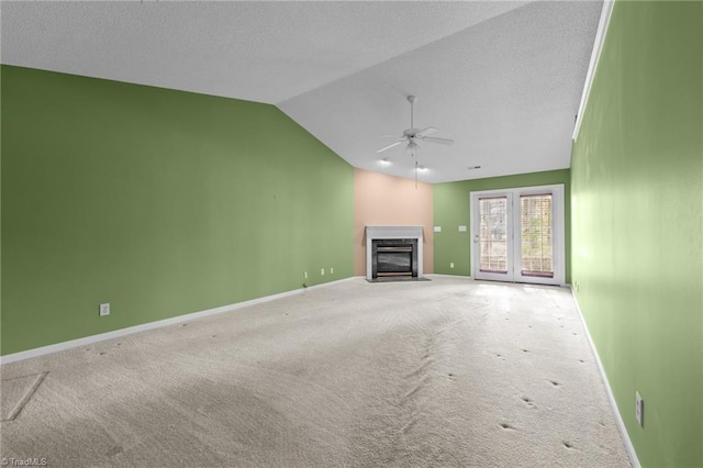3027 Maple Ave Unit M2, Burlington, NC 27215 - unfurnished living room with a fireplace with flush hearth, vaulted ceiling, carpet flooring, a ceiling fan, and baseboards