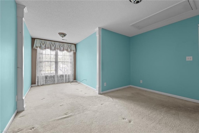 3027 Maple Ave Unit M2, Burlington, NC 27215 - spare room with attic access, carpet floors, a textured ceiling, and baseboards