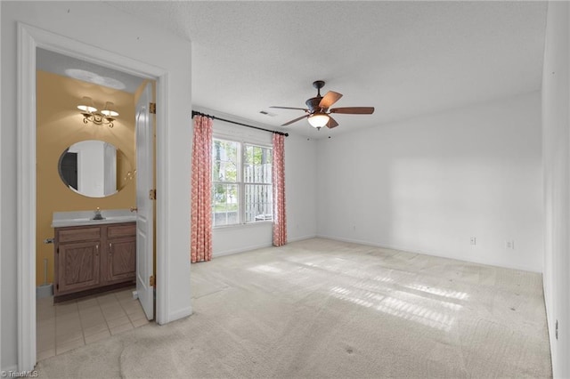 3027 Maple Ave Unit M2, Burlington, NC 27215 - unfurnished room with light carpet, a sink, a ceiling fan, and baseboards