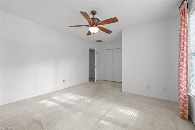 3027 Maple Ave Unit M2, Burlington, NC 27215 - unfurnished bedroom with carpet, multiple windows, baseboards, and a ceiling fan