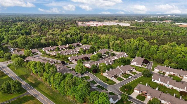 3027 Maple Ave Unit M2, Burlington, NC 27215 - aerial view of property and surrounding area with a heavily wooded area and nearby suburban area