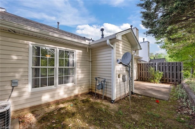 3027 Maple Ave Unit M2, Burlington, NC 27215 - view of side of property with central AC and a chimney