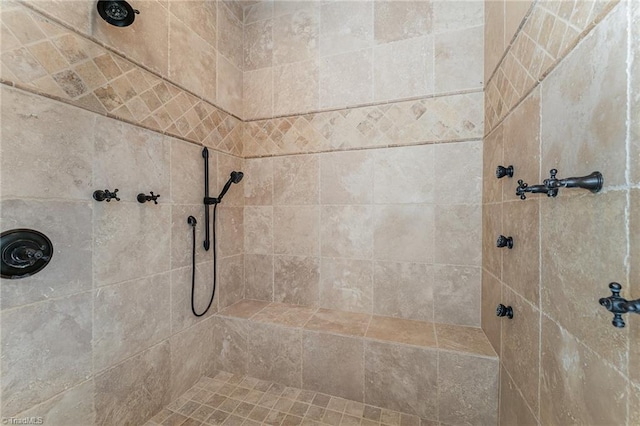 bathroom featuring tiled shower