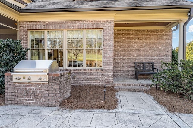 view of patio / terrace featuring exterior kitchen and area for grilling