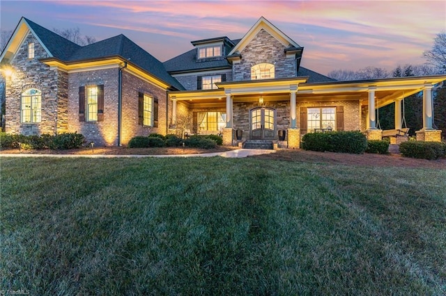 craftsman house with a lawn