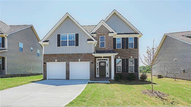 view of front of home with a garage and a front lawn