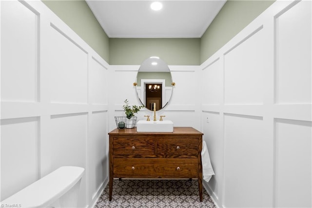 bathroom with vanity and toilet