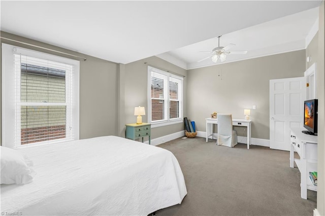 bedroom featuring ceiling fan and carpet