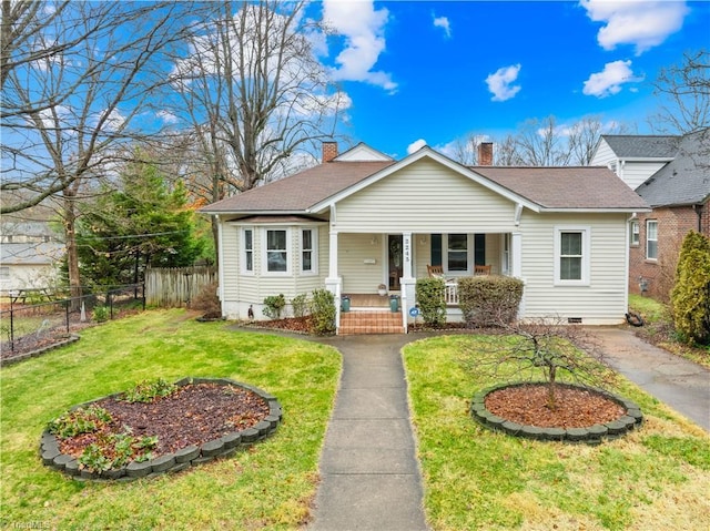 view of front of house with a porch and a front lawn