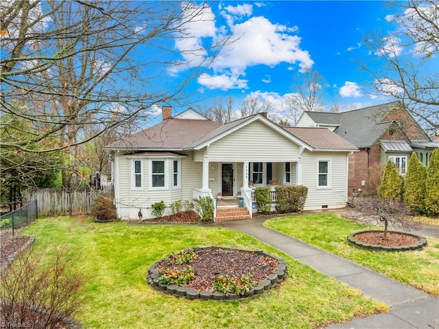 single story home with a front yard and a porch