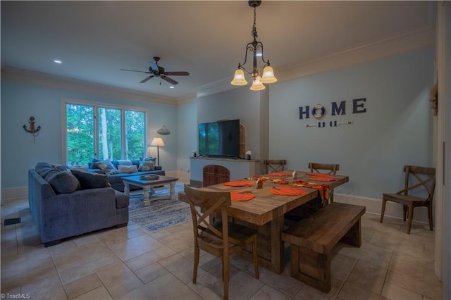 dining room with ornamental molding, light tile patterned floors, and ceiling fan with notable chandelier