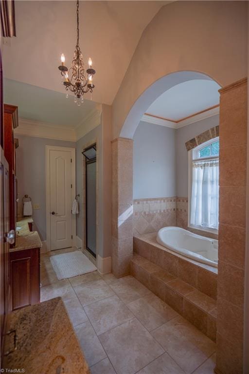 bathroom with vanity, lofted ceiling, shower with separate bathtub, and tile patterned flooring