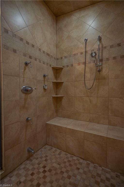 bathroom featuring tiled shower