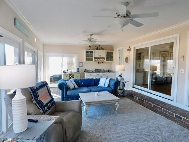 living room with ornamental molding