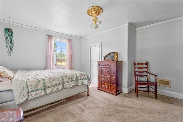 carpeted bedroom with visible vents, baseboards, and crown molding