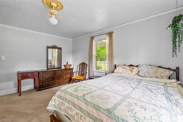 bedroom featuring carpet floors, crown molding, and baseboards