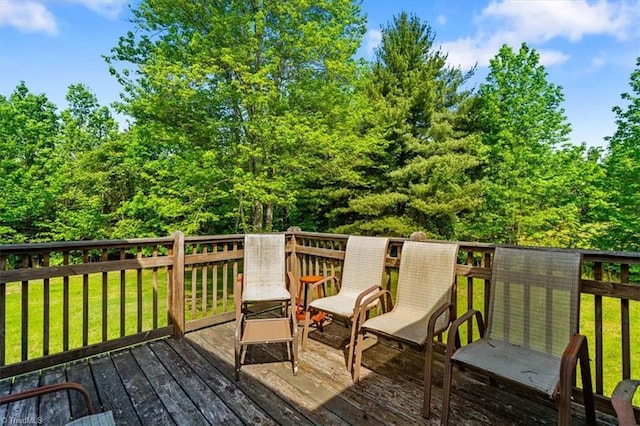 wooden terrace with a yard