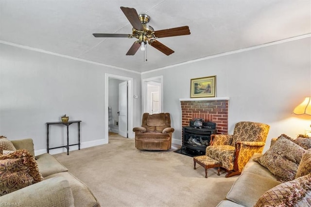 living area featuring ceiling fan, a wood stove, carpet floors, baseboards, and ornamental molding