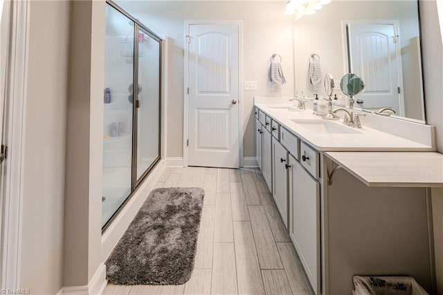 109 Red Maple Way, King, NC 27021 - full bath with double vanity, a shower stall, and wood finished floors