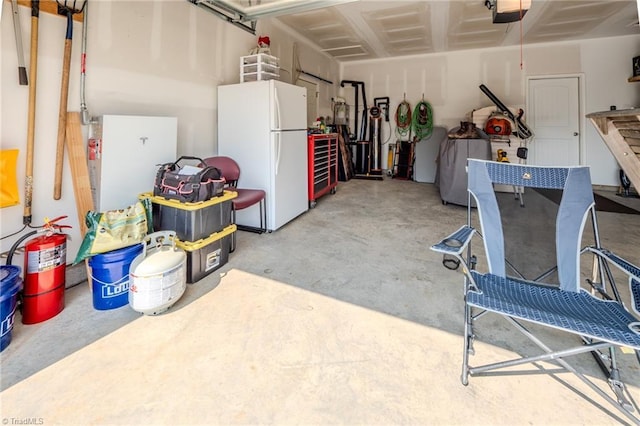 109 Red Maple Way, King, NC 27021 - garage featuring freestanding refrigerator and a garage door opener
