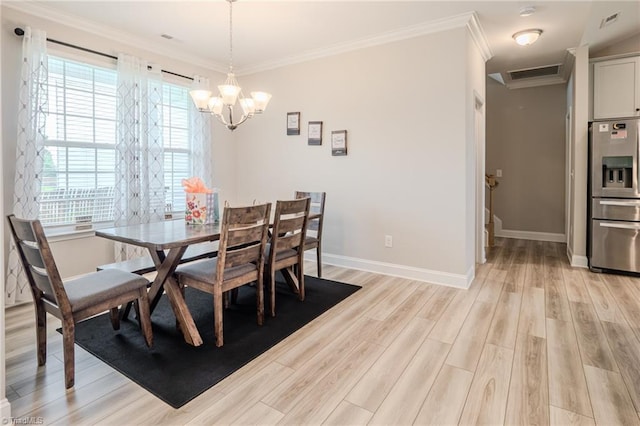 109 Red Maple Way, King, NC 27021 - dining room featuring a chandelier, light wood-type flooring, baseboards, and crown molding