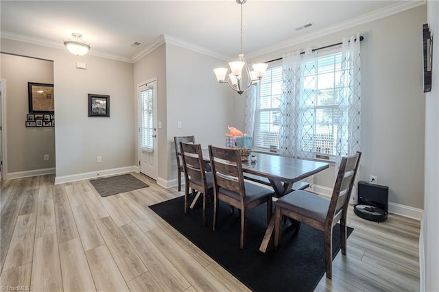 109 Red Maple Way, King, NC 27021 - dining space with a chandelier, light wood finished floors, ornamental molding, and baseboards