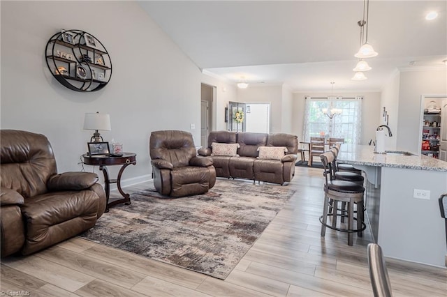 109 Red Maple Way, King, NC 27021 - living area with crown molding, light wood-type flooring, and a chandelier