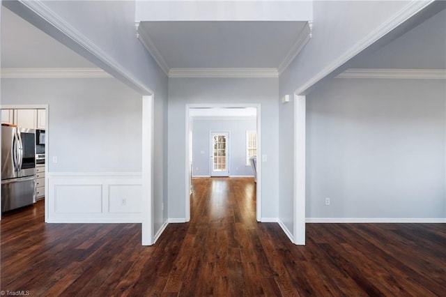 hall with ornamental molding and dark wood-type flooring