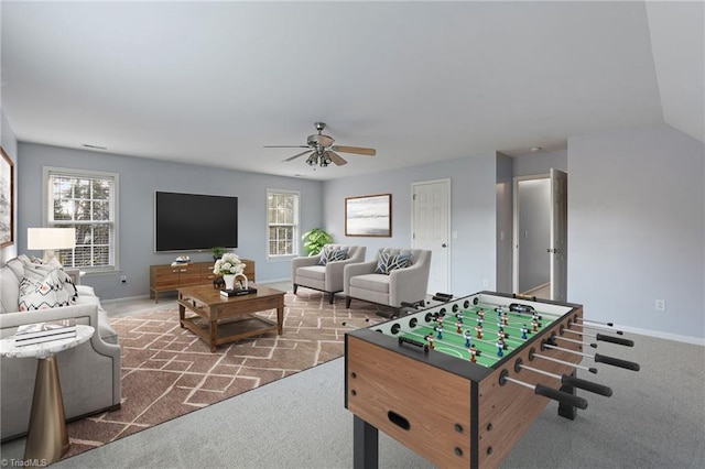 game room with carpet, a wealth of natural light, and ceiling fan