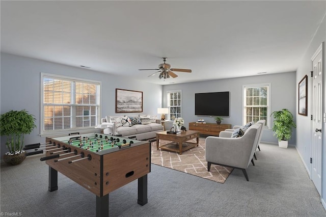 playroom featuring light colored carpet and ceiling fan