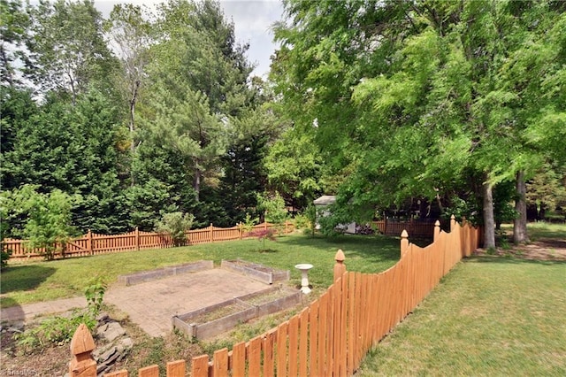 view of yard featuring a garden and fence