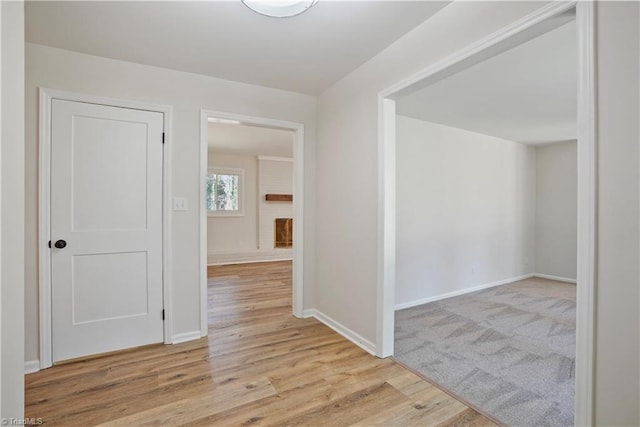 interior space featuring wood finished floors and baseboards