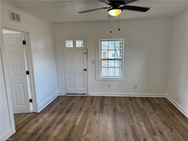 entrance foyer featuring crown molding, ceiling fan, and dark wood-type flooring