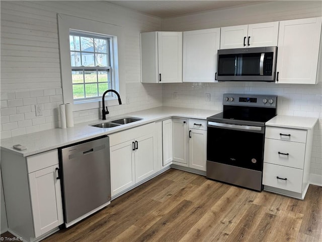 kitchen featuring sink, white cabinetry, and stainless steel appliances