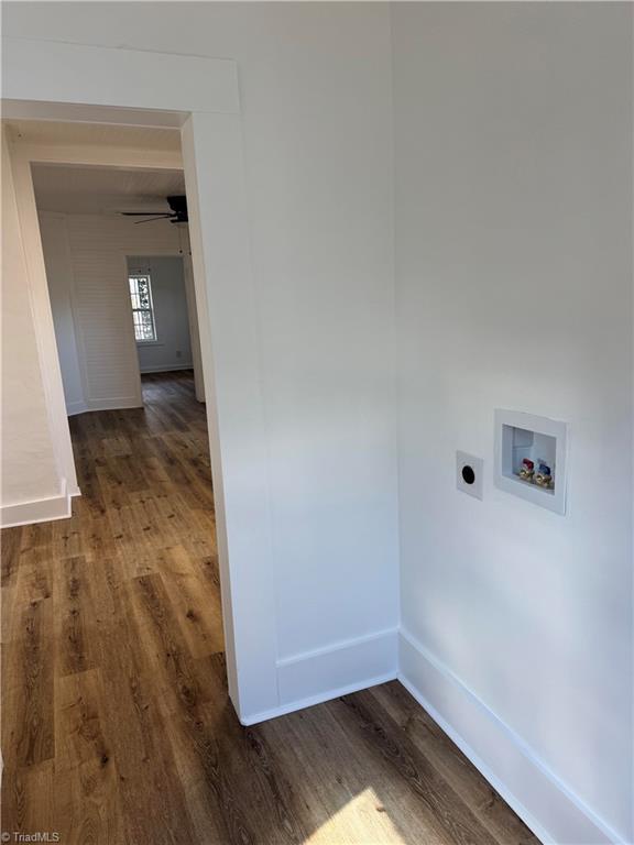 washroom with hookup for an electric dryer, dark hardwood / wood-style flooring, and washer hookup