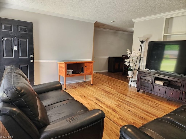 6905 Harlow Dr, Archdale, NC 27263 - living area with ornamental molding, light wood-style flooring, a textured ceiling, and baseboards